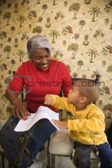 Grandmother with grandson coloring.