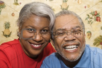 Mature couple smiling.