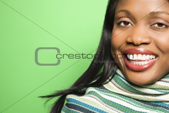 African-American woman wearing green scarf.