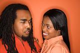 African-American couple wearing orange clothing.