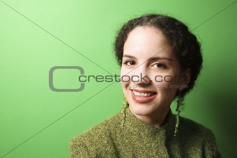 Young Caucasian woman wearing green clothing.