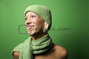 Young Caucasian woman wearing winter hat and scarf.