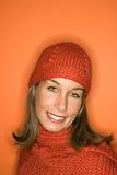 Caucasian woman wearing winter hat and scarf.