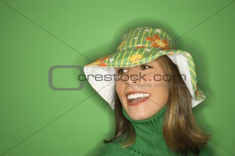 Young Caucasian woman wearing floppy hat.