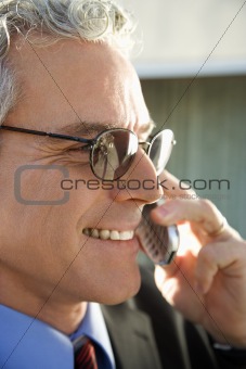 Businessman talking on cellphone.