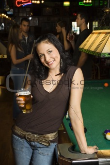 Young woman holding beer.