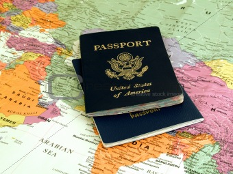 international travel - 2 passports on world map