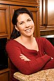 Portrait of mid-adult female in kitchen.