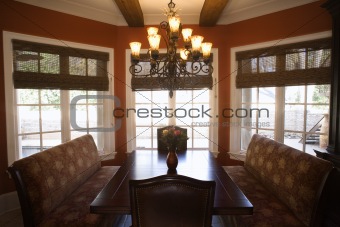 Dining room with table and chairs in home.
