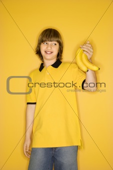 Caucasian boy with bananas.