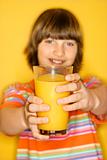 Caucasian boy with glass of orange juice.