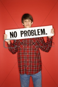 Caucasian teen boy holding no problem sign.