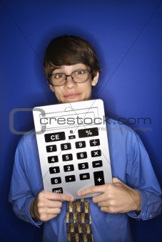 Caucasian teen boy holding calculator.