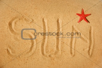 Sun writing on sand and red star