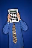 Caucasian teen boy holding big calculator.