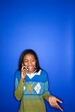 African-American teen girl talking on cellphone.