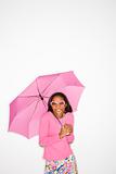 African-American teen girl holding pink umbrella. 