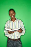African-American teen boy with book.