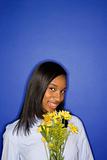 African-American teen girl with flowers.