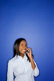African-American teen girl holding cellphone.