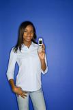African-American teen girl holding cellphone.