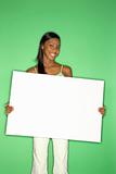 African-American teen girl holding blank white board.