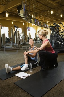 Adult female with personal trainer.