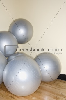 Balance balls stacked in gym.