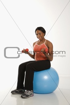 Woman exercising with ball.