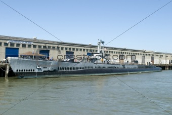 Submarine parked in dock