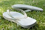 Thongs on grass on a summer day