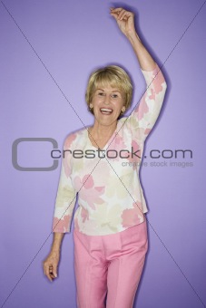 Woman dancing and smiling.