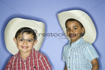 Boys wearing cowboy hats.