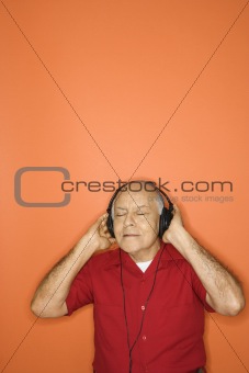 Man listening to headphones.