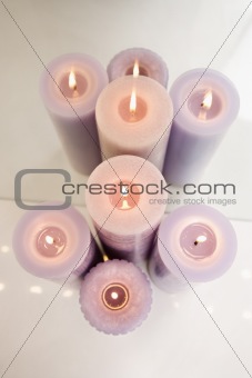 Overview of purple burning candles.