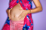 Pregnant woman with hands on stomach.