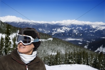 Woman skier in mountains.
