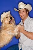 Dog and man wearing cowboy hats.