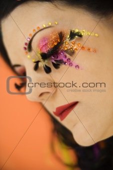Caucasian woman wearing unique makeup.