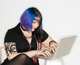 Portrait of Caucasian woman with laptop.