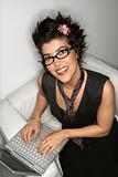 Hispanic woman on laptop.
