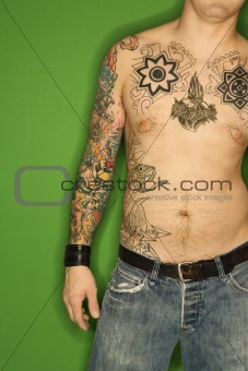 Shirtless Caucasian man with tattoos.