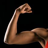 Strong female bicep flexing.
