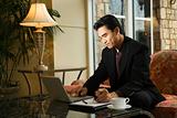 Young Businessman using Laptop
