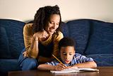 Woman Helping Son with Homework