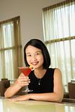 Attractive Young Woman Smiling with Beverage