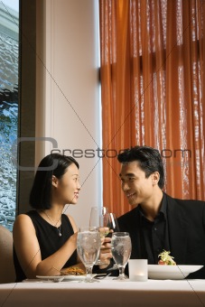Attractive Young Couple Smiling at Each Other