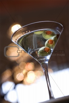 Martini With Olives Reflected in Top of Drink
