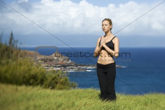 Attractive Young Woman Standing in Meditation
