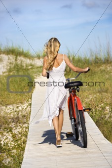 Girl Walking Bike on Boardwalk